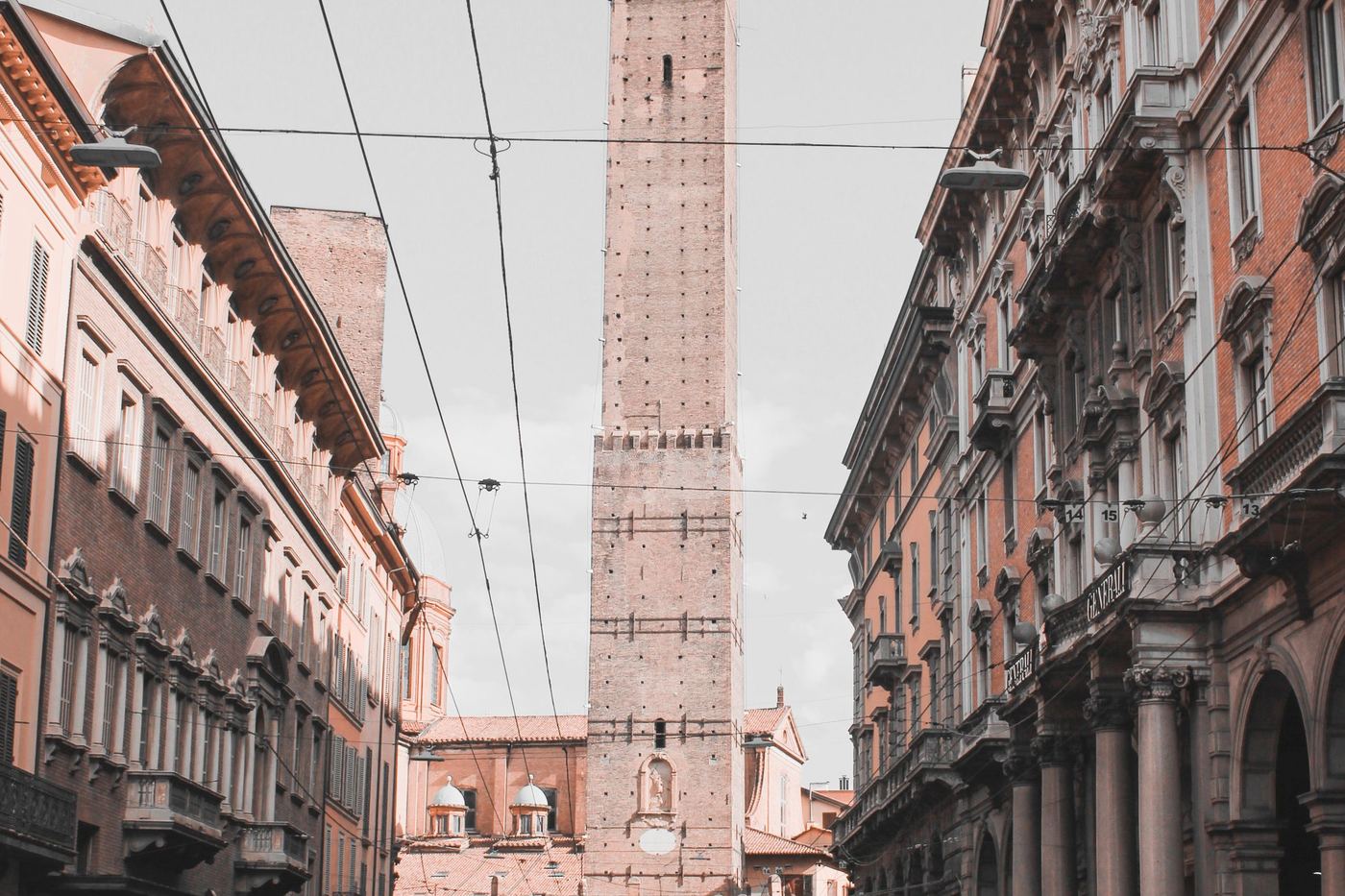 A view of the Asinelli tower rising above a Bologna street, Emilia-Romagna